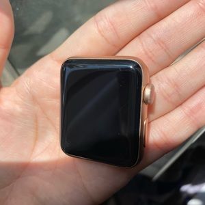 Apple Watch 42 MM Aluminum case Gold with 2 wrist bands.